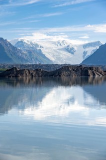 Mountain landscape reflected in glacial lake, Mount Blackburn and Kennicott Glacier, McCarthy Road,