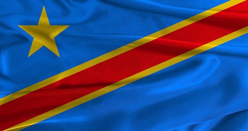Flag of the Democratic Republic of the Congo with fabric textured background. Close up of National