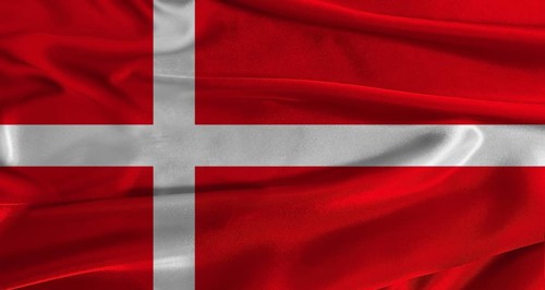 Flag of Denmark with fabric textured background. Close up of National flag of Denmark with