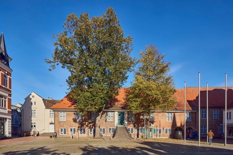 City museum, historic town hall, brick building, facade with windows, museum, staircase, square of