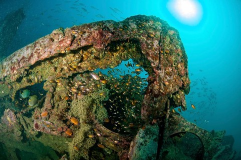Underwater photo parts of former sunken tin excavator Boonsung wreck off the coast of seaside