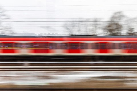 S-Bahn on the open route. motion blur. Esslingen, Baden-Württemberg, Germany