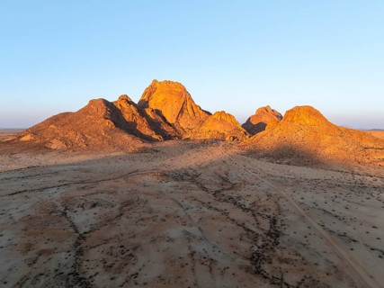Aerial view, sunset, mountains in the desert, Spitzkoppe summit, Namib desert, Namibia