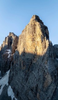 Aerial view, alpine panorama, Cima Tosa and rocky peaks at sunrise with alpine glow, picturesque