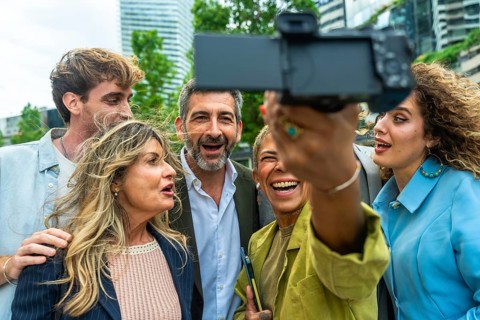 Group of diverse business professionals and colleagues enjoying a moment together, laughing and