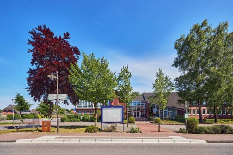 Neuenkirchen Rathaus bus stop, town hall of the municipality of Neuenkirchen-Vörden, street,