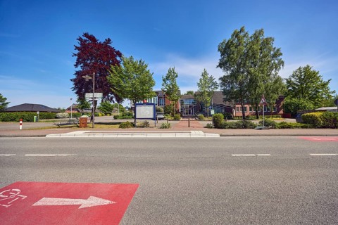Neuenkirchen City Hall bus stop, town hall of the municipality of Neuenkirchen-Vörden, street,