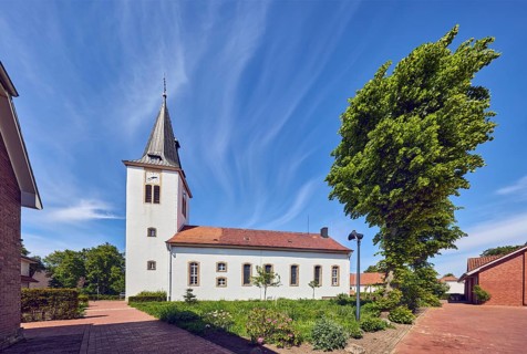 Ev. Church -Luth. parish of Vörden, church tower, general architecture, paving brick walkway, herb