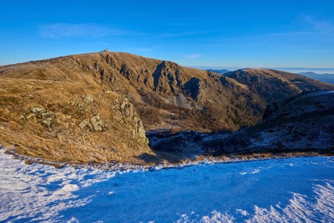 Snowy heights reveal vast valleys under clear skies and sunshine, winter, Route de Cretes, Hohneck,