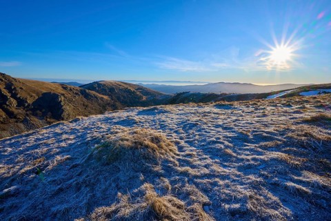 A frosty landscape under bright sunlight and a clear blue sky, winter, Route de Cretes, Hohneck, La