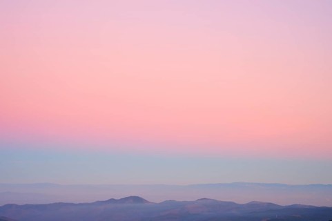 Mountains under a clear sunset sky in pastel shades of pink, purple and blue, viewing, Rhine