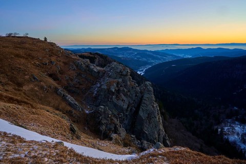 Rocky elevation with wide horizon at sunset, looking towards the Rhine Valley, viewpoint, La Gorge