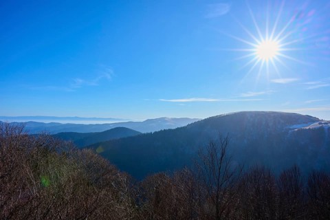 Bright sun over mountains with clear blue sky, winter view, morning, view, Rhine Valley,