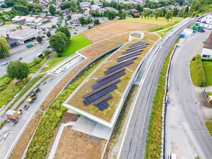 Modern solar roof construction in an urban environment, surrounded by infrastructure, new Park and