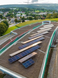 Solar panels on a roof with views of the city and surrounding hills, new Park and Ride Calw