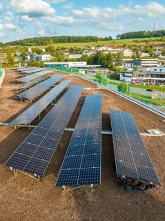 Rows of solar modules with views of the surrounding area and green hills, new Park and Ride Calw