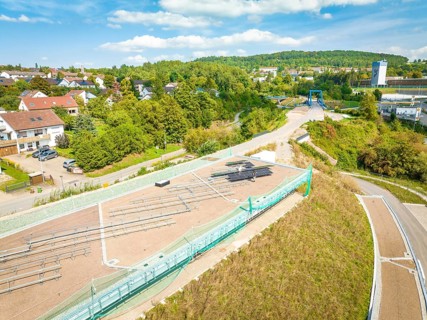 Overview of a village with a solar system in the neighborhood under blue skies, new Park and Ride