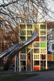 Children's playground with colorful climbing tower and slides, Immanuel-Kant-Park, Duisburg, North