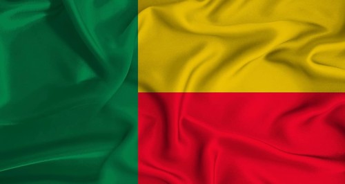 Realistic Benin flag waving. Close up of flag of Benin with cloth texture