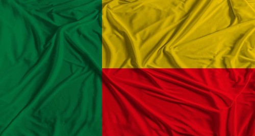 Benin flag with fabric texture background. National flag of Benin with cloth texture
