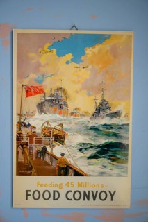 Propaganda poster of a convoy fleet with stormy sea and clouds, in the Partisan Museum in the old