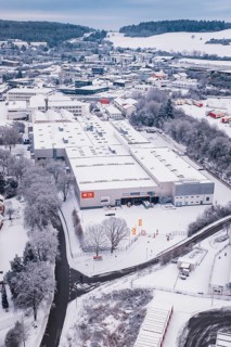 Snowy industrial view surrounded by trees and roads, in a winter landscape, Calw, Black Forest,