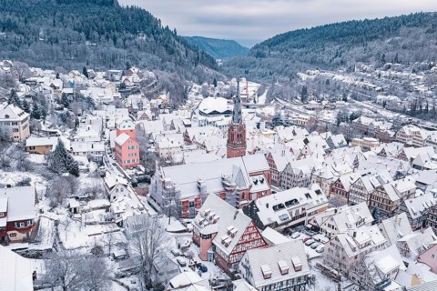 Snowy old town with church and half-timbered houses in a scenic area, Calw, Black Forest, Germany