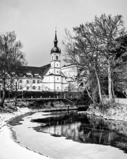 The island channel on the banks of Lake Constance with the Christ Church of St. Konrad, black and