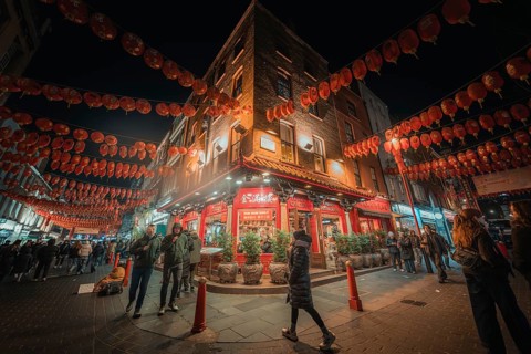 Bustling street scene in Chinatown with red lanterns, China Town, London, England, Great Britain