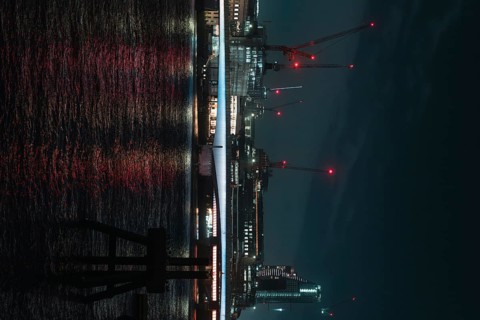 Nocturnal scene with illuminated river and bridge in the background, London, England, Great Britain