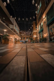 Paved street with fairy lights and urban flair in a friendly evening mood, London, England, Great