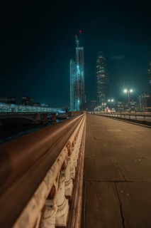 Night scene of an illuminated bridge with skyscrapers in London, London, England, Great Britain