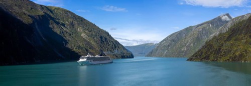 Cruise to Alaska, cruise ship sailing through scenic landscapes, mountains and lakes