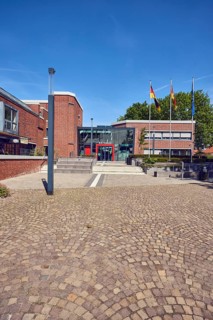 Town hall, brick building, modern architecture, entrance, staircase, lantern, flagpoles, flag,