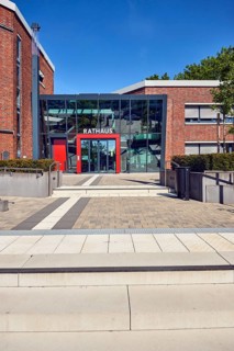 Town hall, brick building, modern architecture, entrance, staircase, stainless steel railing,