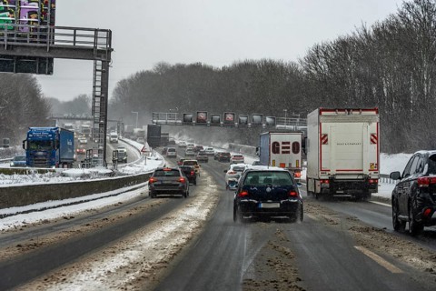 The onset of winter in North Rhine-Westphalia, heavy snowfall, driving on the A3 motorway near
