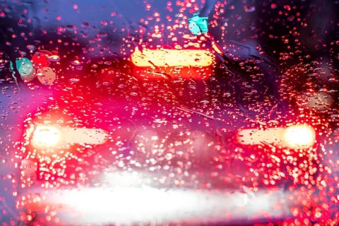 Driving in winter, in snow, rain, rear lights, brake lights