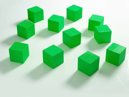 11 green wooden cubes against a white background