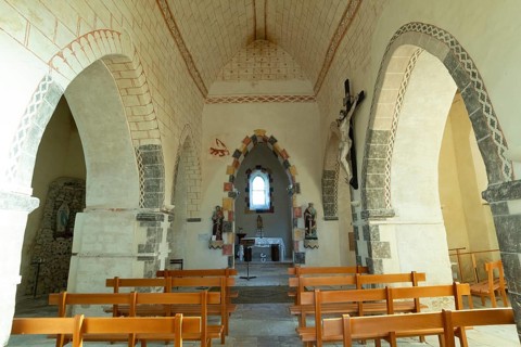 Painted church St Aignan's Church of Begues. Central nave flanked by two aisles. Allier department.