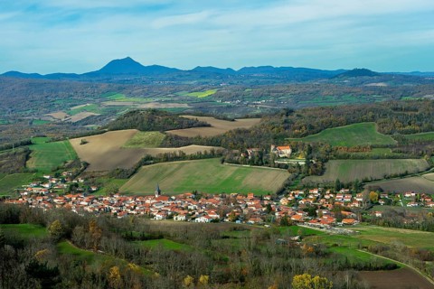 Saint Sandoux village and volcano Puy de Dome in the background, Puy de Dome, Auvergne, France