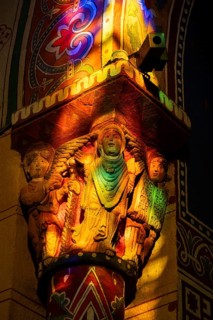 Issoire. Pillar (The Annunciation made to Mary) . The figures are illuminated by colorful light