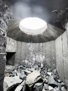 Old Wehrmacht anti-aircraft bunker from the Second World War with worn stairs in a dilapidated,