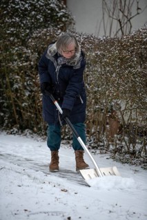 Elderly woman sweeping week with snow shovel, snow shovel, snow remover, shovel, clear, shovel