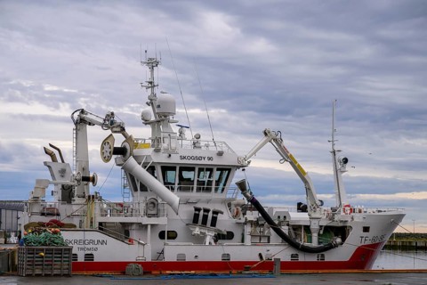 Large fishing vessel in harbor, with cloudy sky, Berlevåg, Finnmark, Norway