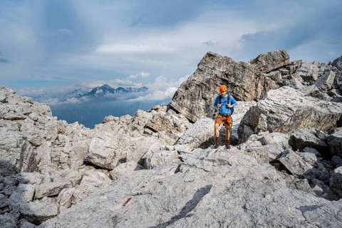 Mountaineers between large boulders, rocky mountain landscape, Via Ferrata SOSAT via Ferrata, in