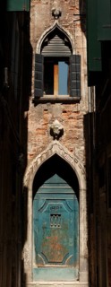 Old entrance gate at the end of Calle Mezzo, Sestiere Castello, Venice, Veneto, Italy
