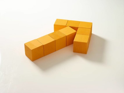 9 yellow wooden cubes against a white background
