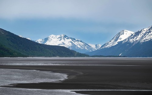 View of the Turnagain Arm estuary at low tide to the mountains of the Kenai Peninsula, Anchorage,