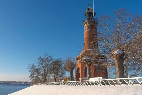 Holtenau lighthouse at the entrance of the Kiel Canal in winter, west bank of the Kiel Fjord,