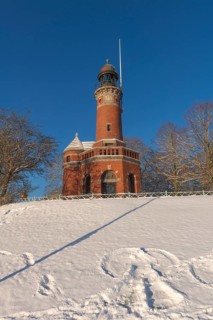Holtenau lighthouse at the entrance of the Kiel Canal in winter, west bank of the Kiel Fjord,